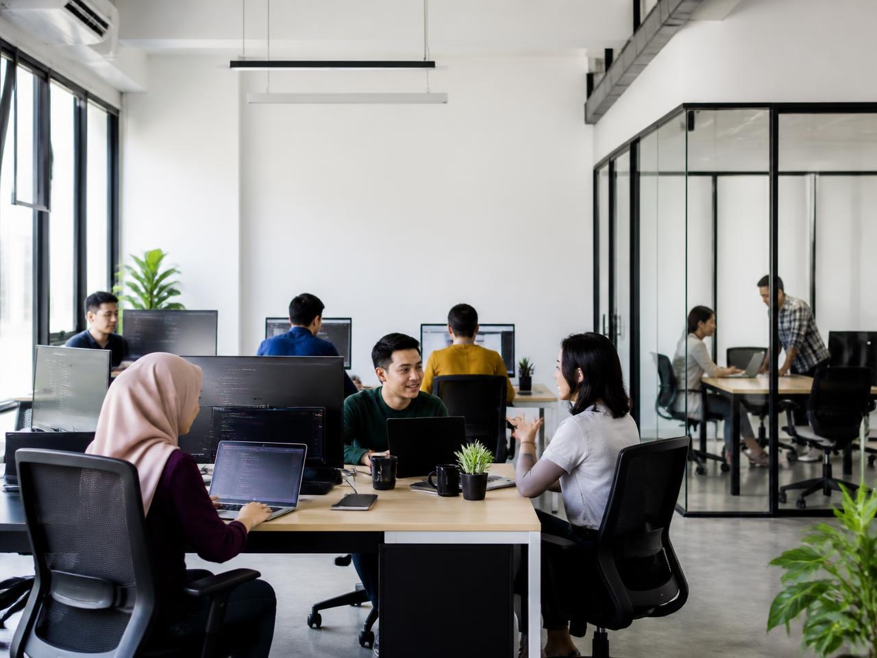 The RankUp Digital team working together in the Cyberjaya office